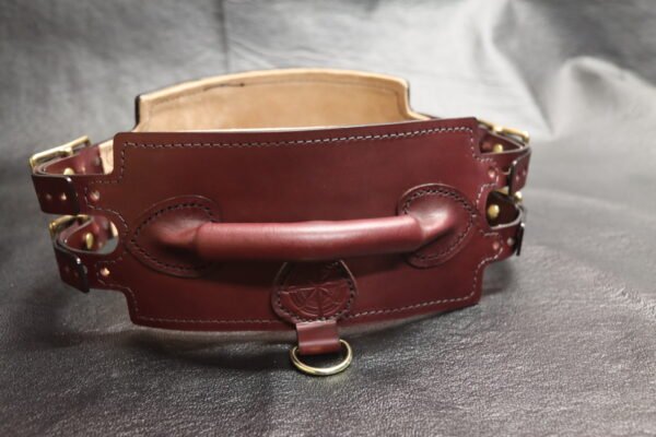 Burgundy English Bridle leather Owned Riding Belt shown from the rear with integrated control handle and solid brass hardware.