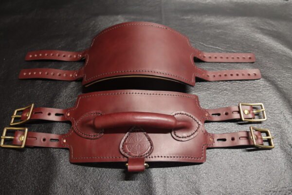 Burgundy English Bridle leather Owned Riding Belt with solid brass hardware, shown front and back while laid flat to highlight its body-shaped curvature and integrated control handle.