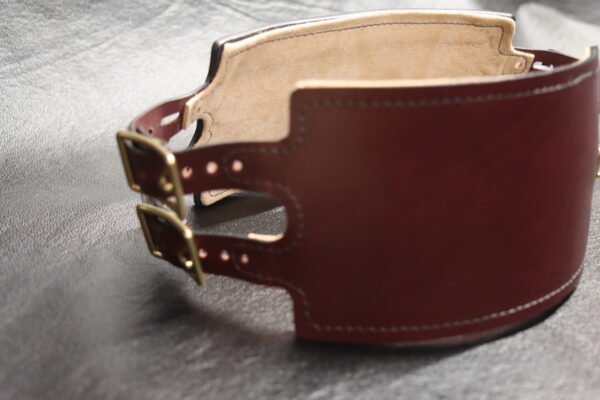 Front three-quarter view of the Burgundy English Bridle leather Owned Riding Belt with solid brass buckle and hardware.
