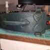 Dark green leather Owned Riding Belt “Treasure Belt” with antiqued brass hardware, raised rear control handle, and four D-ring attachment points.