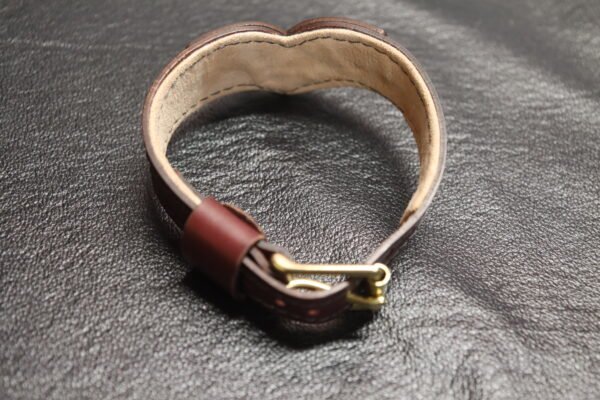 Collar Burgundy 3 Burgundy Drop Tip Sigil Collar shown from an angled view with solid brass hardware and shaped front.