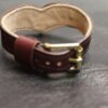 Collar Burgundy 4 Burgundy Drop Tip Sigil Collar shown from another angle, highlighting the leather body and brass hardware.