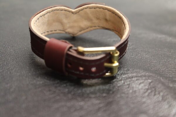 Collar Burgundy 4 Burgundy Drop Tip Sigil Collar shown from another angle, highlighting the leather body and brass hardware.