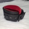 Cuff Closeup 2 Close-up of a black leather Owned Wrist Cuff showing stitching, lining, buckle, and attachment hardware.