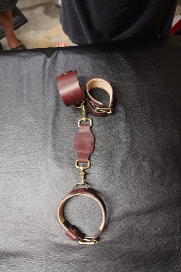 Cuff & Collar 4 Burgundy Drop Tip Sigil Collar shown with matching leather wrist cuffs and restraint hardware.