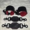 Owned Riding Cuffs 3 Black English Bridle leather Owned Riding Wrist Cuffs with red deersplit lining, shown above two matching leather tethers with black swivel snap hardware.