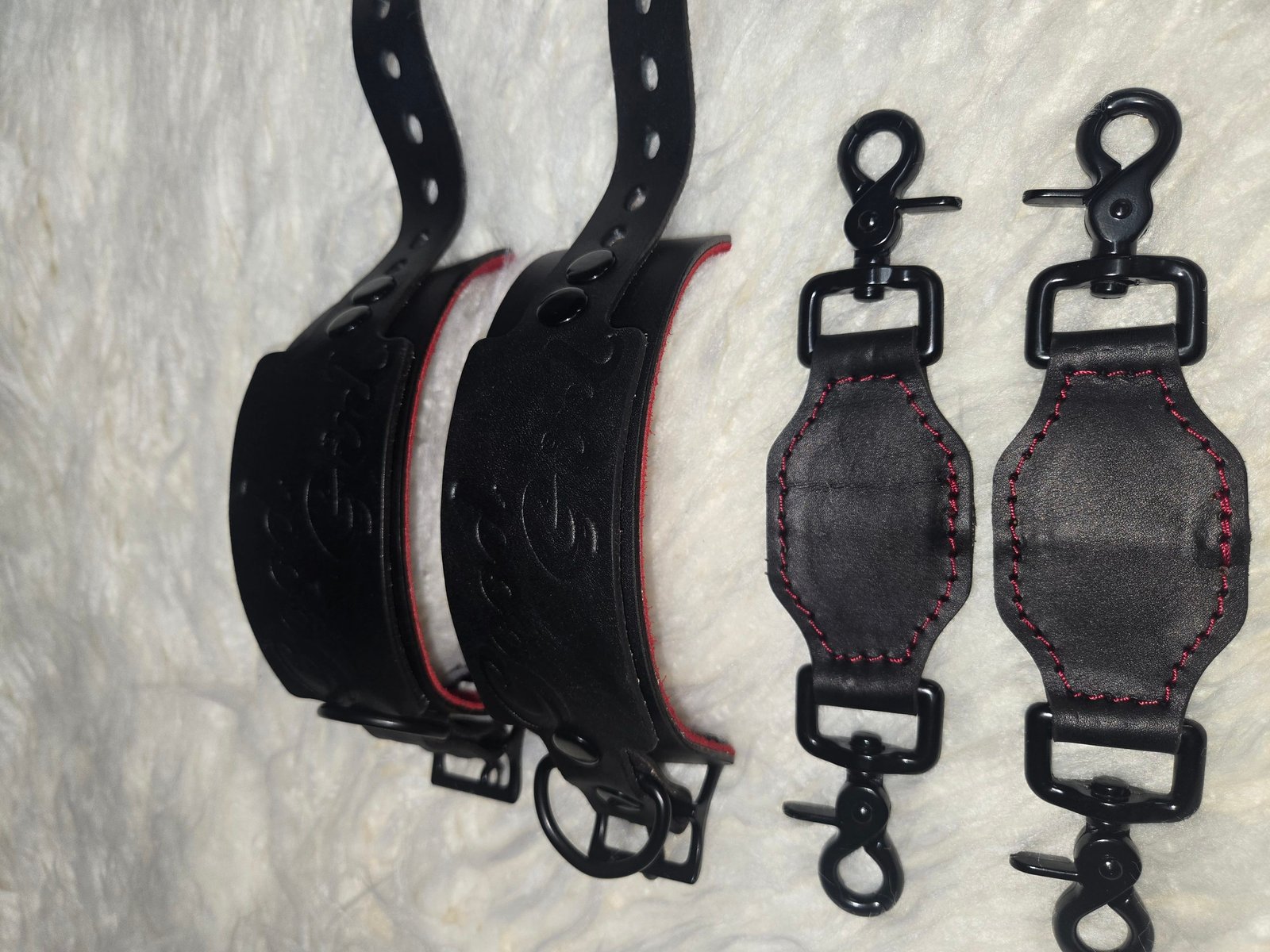Cuff Set - 2 Leather wrist cuff set showing the curved cuff bodies and restraint hardware.