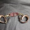 Cuff Set Connected 6 Pair of black leather Owned Wrist Cuffs joined by a matching tether with swivel snap hardware.