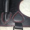 Harness V2.3 Closeup 1 Close-up of Owned Riding Harness leather construction, stitching, edges, and hardware.
