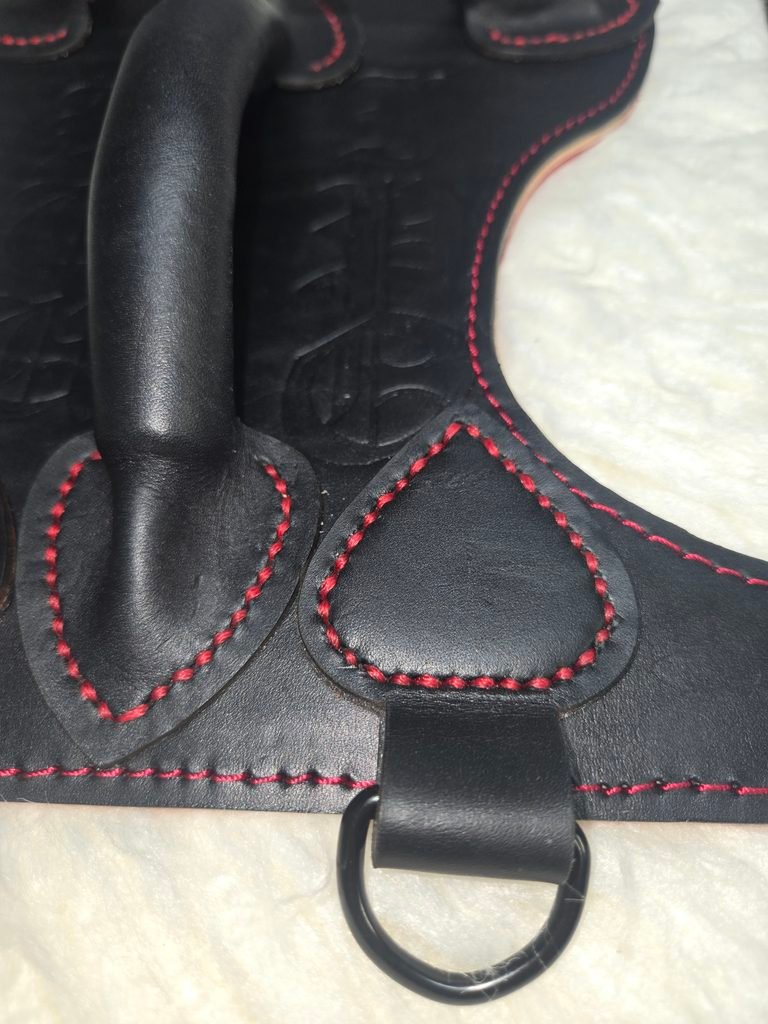 Harness V2.3 Closeup 1 Close-up of Owned Riding Harness leather construction, stitching, edges, and hardware.