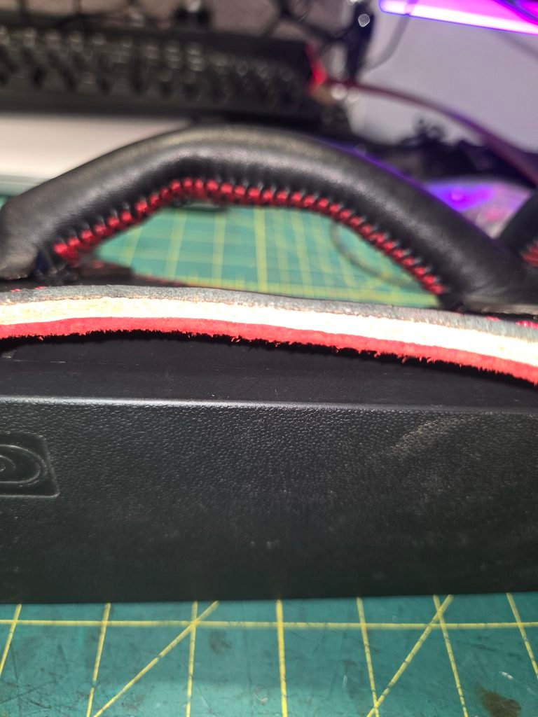 Layered leather components of the Owned Riding Harness back shell before final assembly.