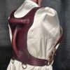 Harness v2.3 - on Mannequin Burgundy - Back 45 Degree Burgundy English Bridle leather Owned Riding BDSM Harness with solid brass hardware, shown from the rear three-quarter view with dual handles and multiple D-ring attachment points.